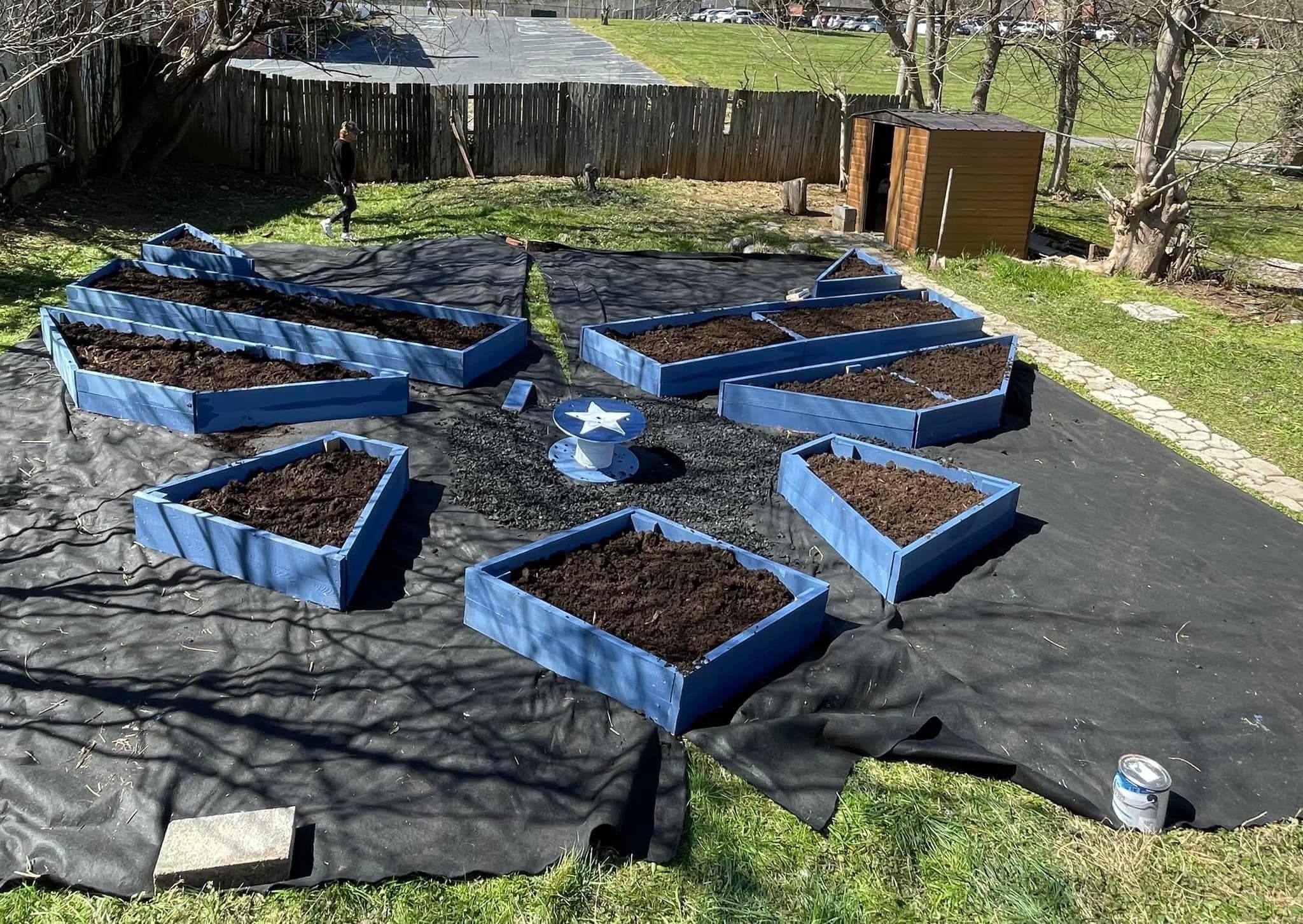 Volunteers and veterans gathered on build day, working together to construct a therapeutic garden