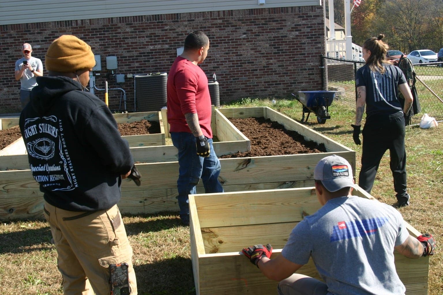Volunteers building a garden together